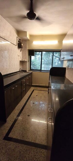 Kitchen in 1 BHK Apartment at Sterling CHS, Andheri West – for Sale