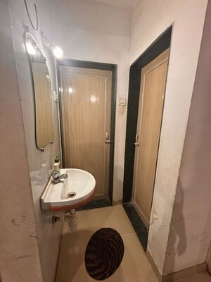 Bathroom in 1 BHK Apartment at Puranik City, Kasarvadavali – for Rent
