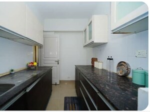 Kitchen in 2 BHK Apartment at Signature Global Orchard Avenue, Sector 93 – for Sale