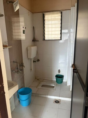 Bathroom in 2 BHK Apartment at Raunak Unnathi Greens, Kasarvadavali – for Rent