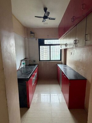 Kitchen in 2 BHK Apartment at Raunak Unnathi Greens, Kasarvadavali – for Rent