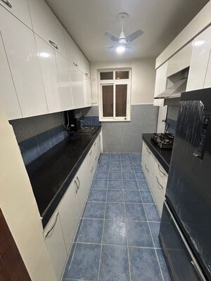 Kitchen in 3.5 BHK Apartment at Sikka Karmic Greens, Sector 78 – for Rent