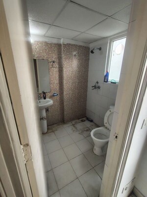 Bathroom in 2 BHK Apartment at Nilaya Greens, Raj Nagar Extension – for Rent