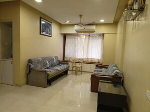 Living Room in 2 BHK Apartment at Vasant View, Malad West – for Rent