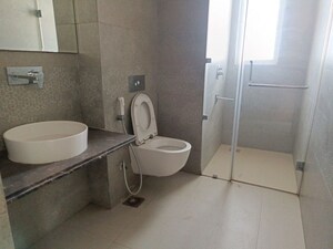 Bathroom in 4 BHK Apartment at Mahagun Mezzaria, Sector 78 – for Sale