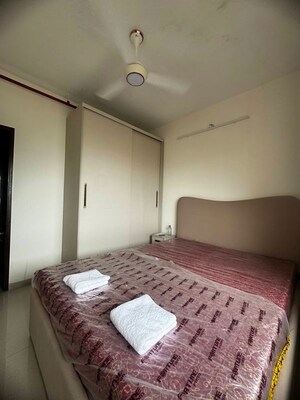 Bedroom in 2 BHK Apartment at Omkar Signet, Malad East – for Rent