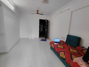 Living Room in 1 BHK Apartment at Cosmos Enclave, Kasarvadavali – for Rent