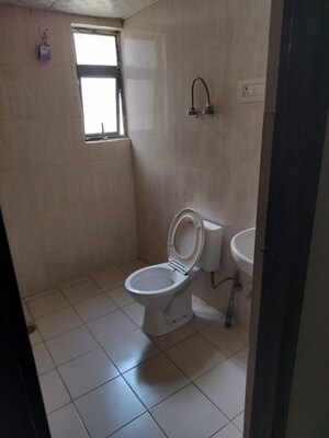 Bathroom in 1 BHK Apartment at Devika Skypers II, Raj Nagar Extension – for Rent