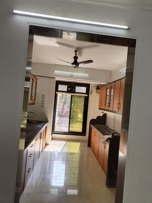 Kitchen in 2 BHK Apartment at Tilak Bhavana CHS, Tilak Nagar – for Rent