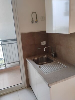 Kitchen in 3.5 BHK Apartment at Puri Emerald Bay, Sector 104 – for Sale