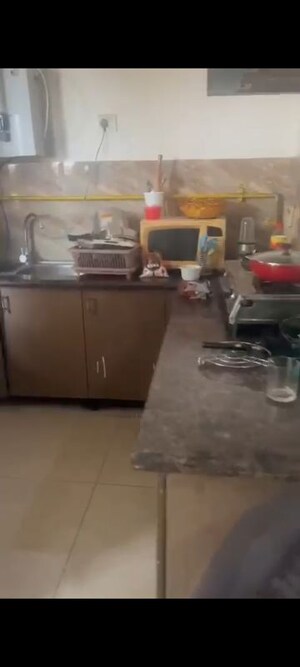 Kitchen in 2 BHK Apartment at Gaurs Cascades, Raj Nagar Extension – for Rent