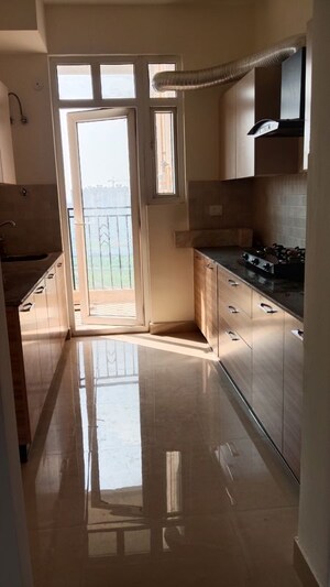 Kitchen in 3 BHK Apartment at ATS Homekraft Pious Hideaways, Sector 150 – for Rent