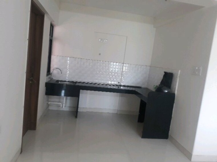 Kitchen, atul-western-hills-phase-2 1.5 Bedroom 950 Sq.Ft. Apartment In Baner Pune 10676688