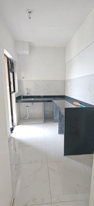 Bathroom in 2 BHK Apartment at Runwal Gardens, Dombivli East – for Rent