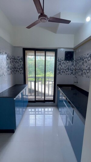 Kitchen in 1 BHK Apartment at Unnati Woods CHS, Kasarvadavali – for Rent