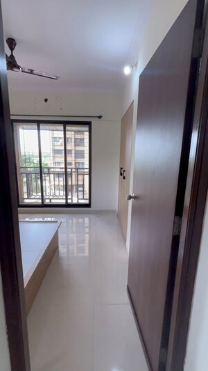Master Bedroom in 1 BHK Apartment at Unnati Woods CHS, Kasarvadavali – for Rent