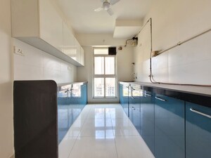 Kitchen in 3 BHK Apartment at Godrej Emerald, Ghodbunder Road – for Rent