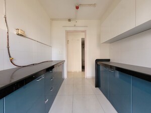 Kitchen in 3 BHK Apartment at Godrej Emerald, Ghodbunder Road – for Rent