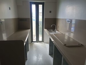 Kitchen in 4 BHK Apartment at Rustomjee Paramount, Khar West – for Sale