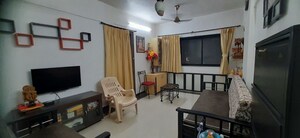 Living Room in 1 BHK Apartment at Alica Nagar CHS, Kandivali East – for Sale