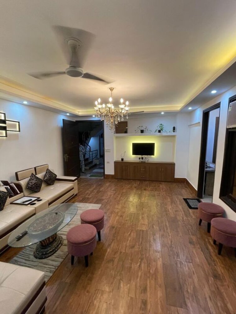 Living Room, advetaya-smart-homes 2 Bedroom 800 Sq.Ft. Apartment In Sector 104 Noida 10678110