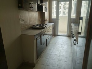 Kitchen in 2 BHK Apartment at Mahagun Moderne, Sector 78 – for Rent