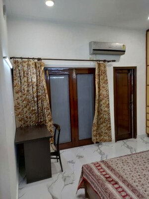 Bedroom in 3 BHK Builder Floor at Nehru Enclave – for Rent
