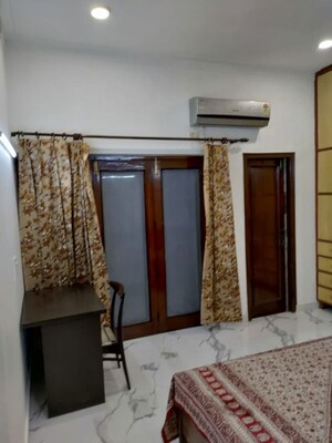 Bedroom in 3 BHK Builder Floor at Nehru Enclave – for Rent