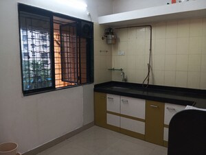 Kitchen in 2 BHK Apartment at Dream Shubhamkaroti CHS, Bhaskar Colony – for Sale
