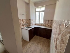 Kitchen in 2.5 BHK Apartment at Amrapali Kingswood, Sector 4 Greater Noida – for Sale