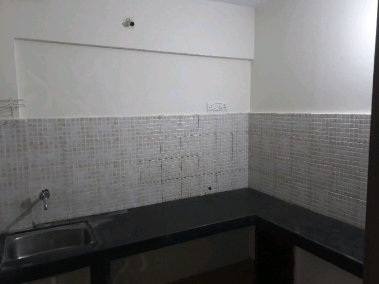 Kitchen, jalan-aura-county-pune 2 Bedroom 1078 Sq.Ft. Apartment In Wagholi Pune 10679357