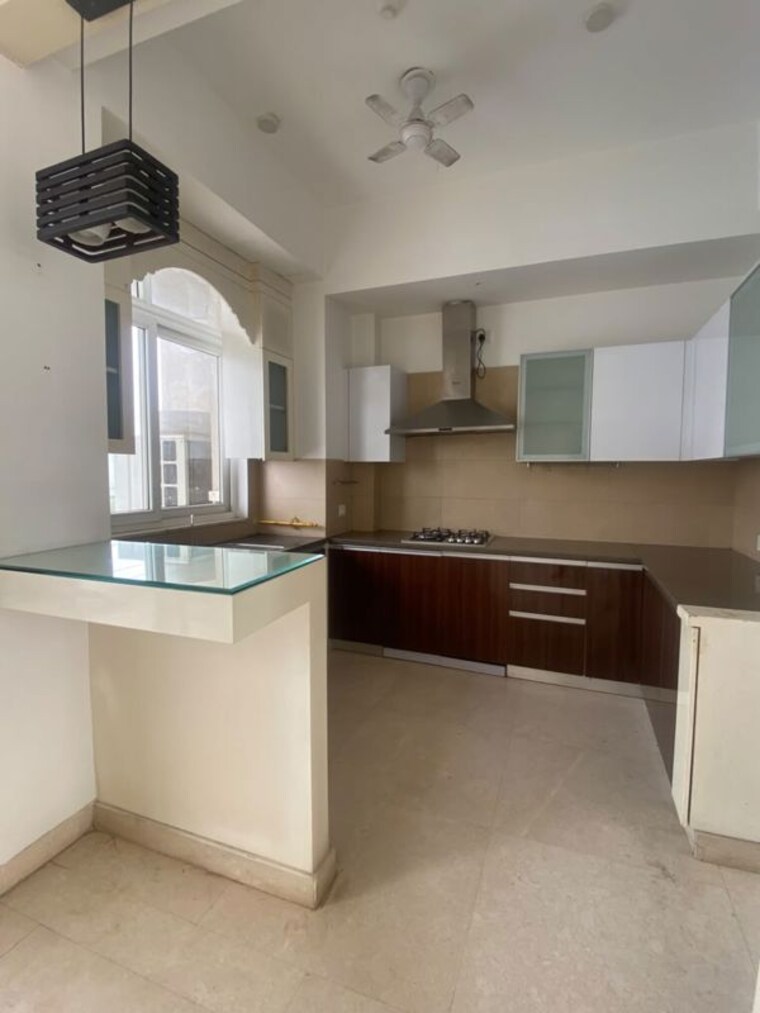 Kitchen, puri-diplomatic-greens-villas 3.5 Bedroom 2250 Sq.Ft. Apartment In Sector 111 Gurgaon 10679873
