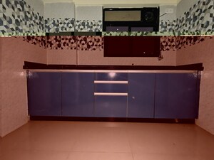 Kitchen in 1 BHK Apartment at Unnati Woods CHS, Kasarvadavali – for Rent