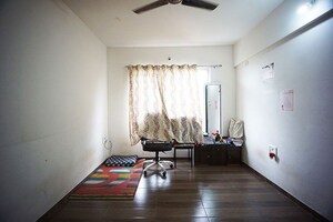 Living Room in 2 BHK Apartment at Charholi Budruk – for Sale