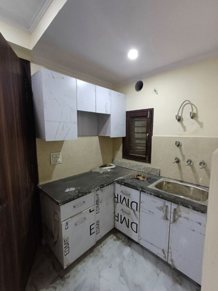 Kitchen, budh vihar 6 Bedroom 85 Sq.Yd. Independent House In Budh Vihar Delhi 10680451