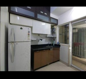 Kitchen in 2 BHK Apartment at The Wadhwa Palm Beach Residency, Nerul Sector 4 – for Rent