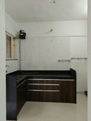 Kitchen in 1 BHK Apartment at GK Jhulelal Towers, Pimple Gurav – for Rent