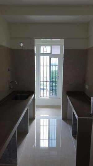 Building Lobby in 2 BHK Apartment at Dosti Tulip, Balkum Pada – for Rent