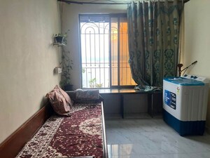 Living Room in 1 BHK Apartment at Versova Heights, Versova – for Rent