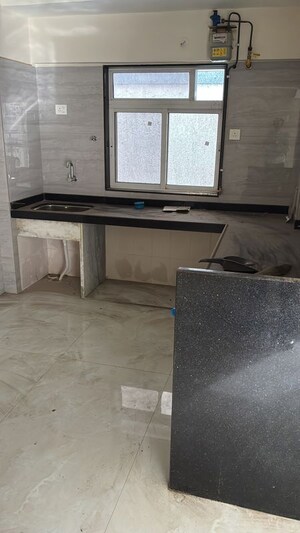 Kitchen in 3 BHK Apartment at Ambarish CHS, Kurla East – for Sale