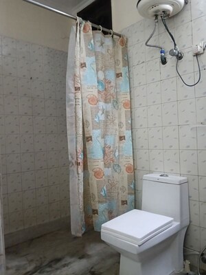 Bathroom in 4 BHK Builder Floor at Pamposh Enclave – for Rent
