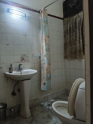 Bathroom in 4 BHK Builder Floor at Pamposh Enclave – for Rent