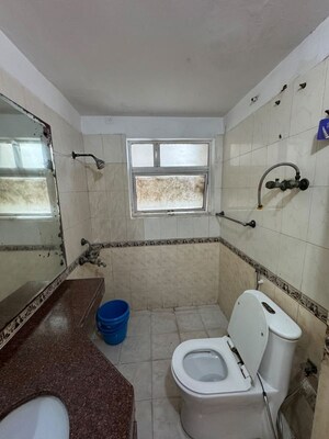 Bathroom in 3 BHK Apartment at Ansal Valley View Estate, Gwal Pahari – for Rent