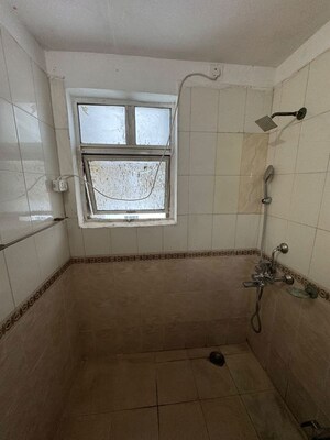 Bathroom in 3 BHK Apartment at Ansal Valley View Estate, Gwal Pahari – for Rent