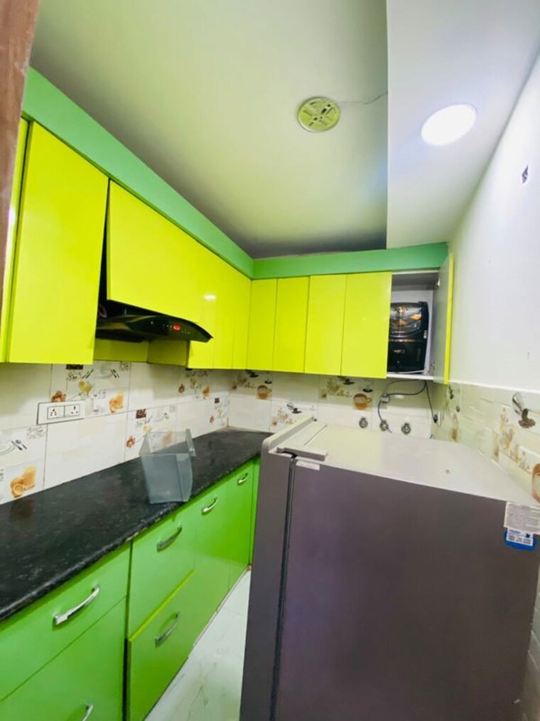 Kitchen, dwarka mor 4 Bedroom 110 Sq.Yd. Builder Floor In Dwarka Mor Delhi 10684543