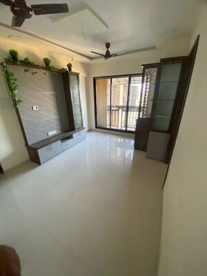 Living Room in 1 BHK Apartment at Raunak Unnathi Woods Phase 7 A And B, Ghodbunder Road – for Rent
