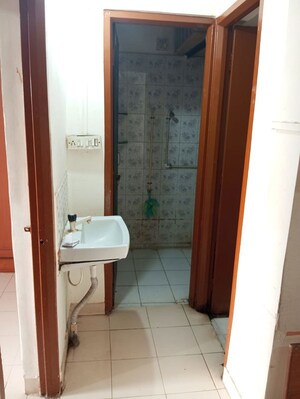 Bathroom in 1 BHK Apartment at Goel Ganga Kunj, Vishrantwadi – for Rent
