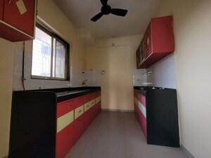 Kitchen in 3 BHK Apartment at Godrej Emerald, Ghodbunder Road – for Rent