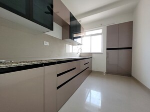 Kitchen in 2 BHK Apartment at Puranik City Reserva, Ghodbunder Road – for Rent