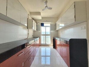 Kitchen in 3 BHK Apartment at Godrej Emerald, Ghodbunder Road – for Rent